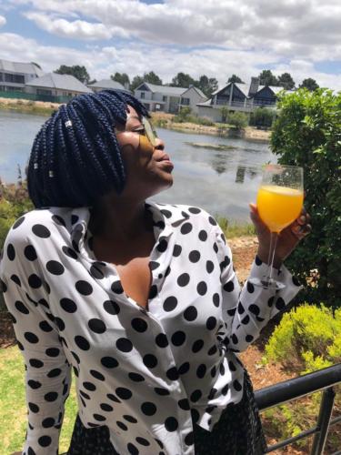 Thuledu, our ESG Specialist enjoying a mimosa in Franschhoek at the Champagne Festival 